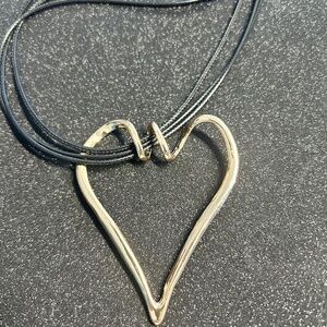 New Gold shinny heart sculptue pendant.
